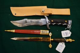 A sheath knife and dagger.