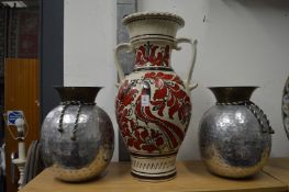 A large pottery twin handled vase and a pair of aluminium vases.