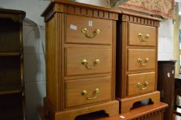 A pair of modern three drawer bedside chests.