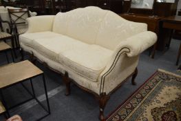 A good Georgian design cream upholstered humpback scroll end settee.