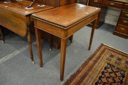 A 19th century mahogany rectangular fold-over tea table.