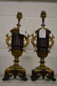 A pair of ormolu and bronze classical style urn shaped lamp bases.