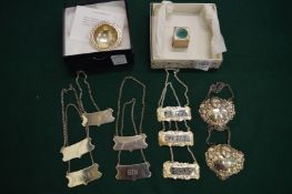 Silver and other decanter labels, a silver snooker chalk holder and another item.