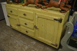 An unusual early large fridge/kitchen storage unit.