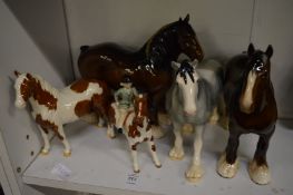 A group of Beswick horses.