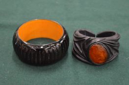 Two chunky bracelets.