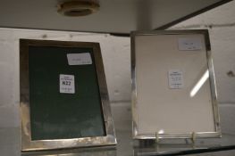 Two silver photograph frames.
