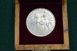 A boxed collectors coin.