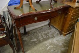 A mahogany writing desk.