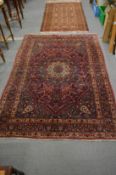 A good Persian rug, 202cm x 139cm.
