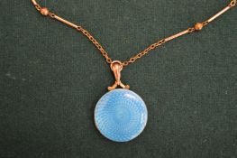 An enamel pendant and chain.