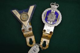 Two car motoring badges.