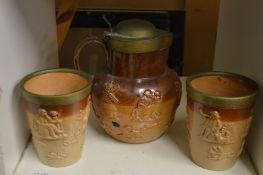 A Doulton jug and pair of matching beakers.