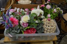Artificial flowers and a quantity of cushions.