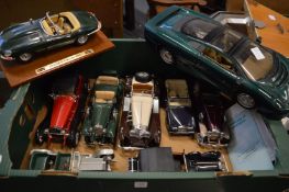 A large Maisto model of a Jaguar XJ220 and other model cars.