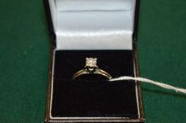 A solitaire ring.