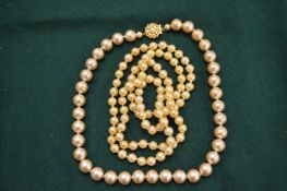 Two pearl necklaces.