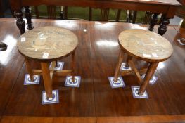 A pair of small inlaid Indian hardwood circular folding tables.
