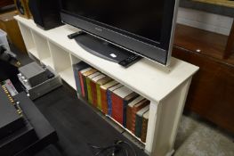 A white painted book shelf.