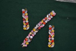 Decorative silver multi-coloured bracelet and matching earrings.