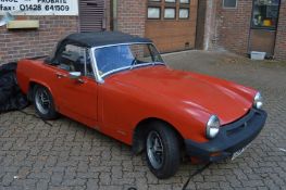 An MG Midget 1500 convertable, registration no: GBW 486S.
