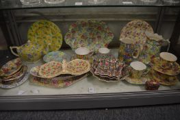 A collection of chintz decorated porcelain.