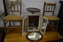 A pair of child's chairs and other items.
