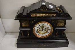 A Victorian slate mantel clock.