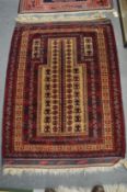 A Persian prayer rug, 131cm x 97cm.
