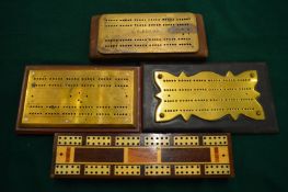 Four cribbage boards.