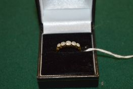 An 18ct gold and diamond five stone ring.