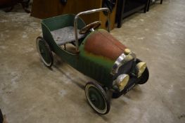 A pedal car.