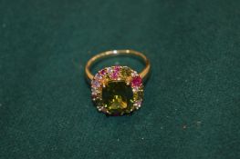 A gem set gilt metal fashion ring.