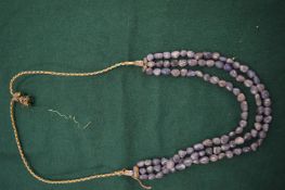 An African amethyst necklace.