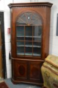 A large Georgian design mahogany standing corner cabinet.