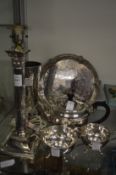 A silver plated corinthian column table lamp, three piece tea service, tray and vase.