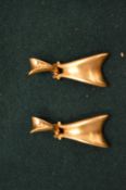 A pair of gilt metal earrings.