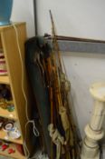 Quantity of old split cane fishing rods and two swagger sticks.