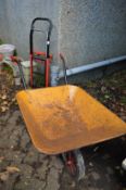 A wheelbarrow and a folding sack truck.