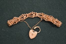 9ct gold bracelet with heart shaped padlock clasp.