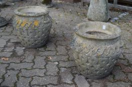 A pair of garden urns.