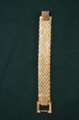 A multi-coloured yellow metal mesh type bracelet stamped 750.