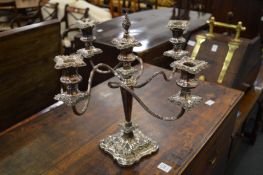 A silver plated four branch five light candelabra.