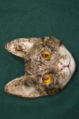 A Winstanley pottery cat face.