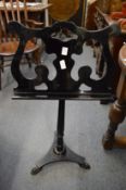 An adjustable ebonised music stand.