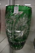 A large pair of Bohemian green tinted cut glass vases.