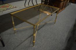 A stylish glass top metal coffee table.