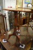 Two 19th century mahogany tripod tables.