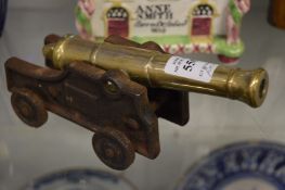 A pair of miniature brass and cast iron canons.