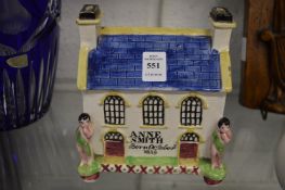 A 19th century Staffordshire pottery house shaped money box, a Christening gift for Anne Smith, born